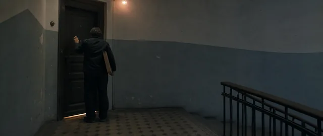 Illustrative frame of Ilya outside the apartment